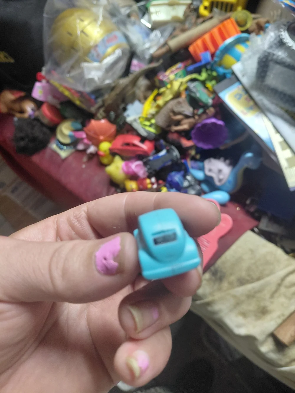 light-blue plastic toy Volkswagen Beetle (bug) car. [1] (https://boonsartshop.co